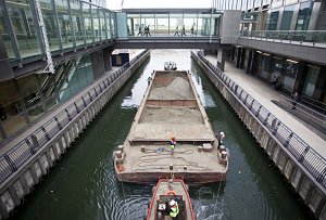 Excavated materials from the Canary Wharf site departing by barge on 30 September 2009