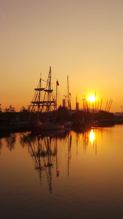 Some of Tall Ships Regatta fleet: sunrise at West India Dock