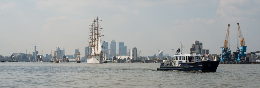 The fleet follows PLA launch Barnes downriver, passing through the Thames Barrier